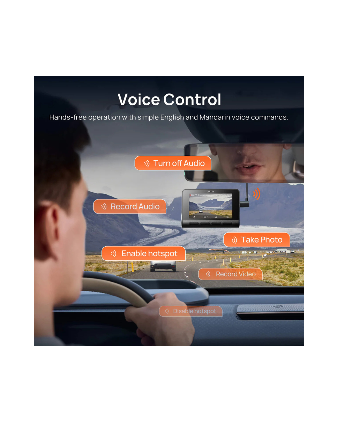 Person driving a car with a dashboard display showing voice control features.