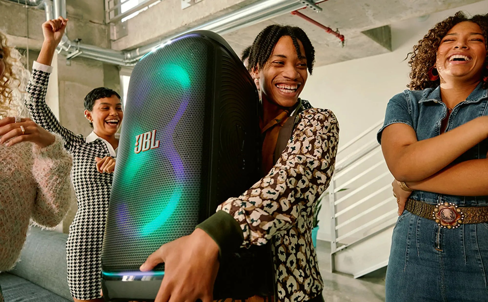 Group enjoying music with JBL PartyBox Stage 320 speaker