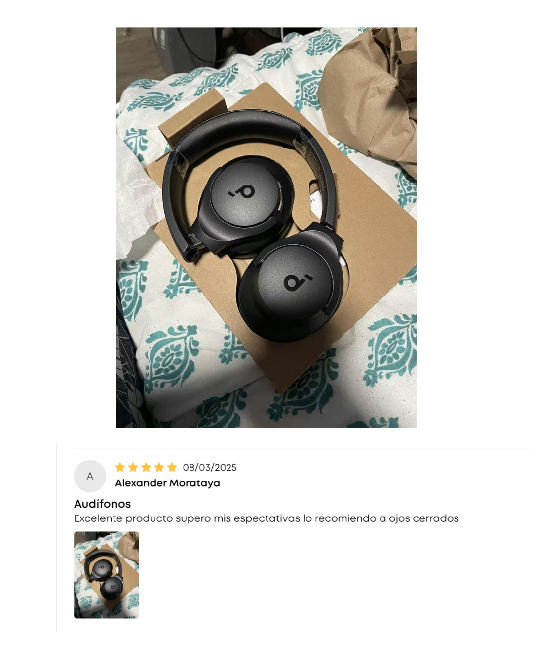 Black headphones on a box with a product review overlay